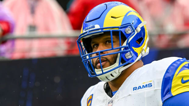 Aaron Donald looks up wearing a
                                                                                 helmet
